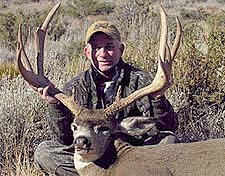 John Fletcher with a 30 inch wide Mule Deer