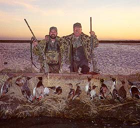 Father and son team of Dwight and Don Reeve with their limits of ducks.